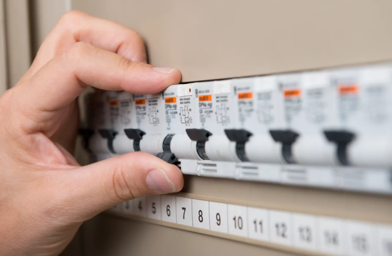 closeup-person-s-hand-repair-switchboard-scaled-1.webp
